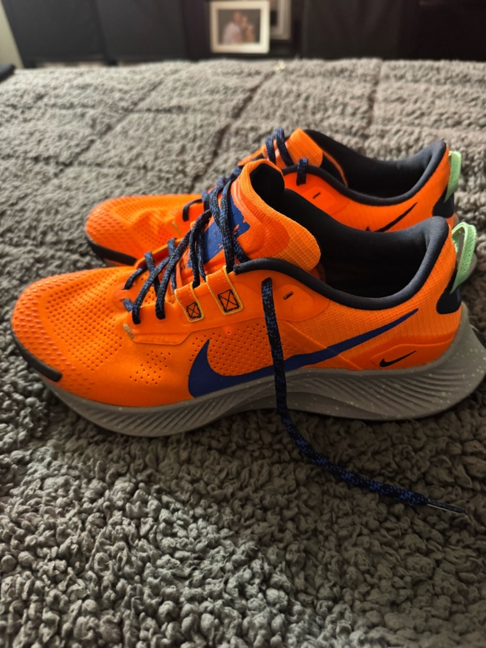 Nike Men's Bright Orange Athletic Running Shoes with Blue Swoosh
